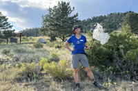 Camp host Rene picking up trash