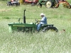 Larry mows Vickers Ranch hay field on John Deer tractor