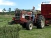 Paul ponders the weather while haying on the International 584