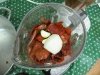 Blend red chili onion and garlic for homemade red tamales
