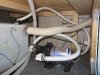 Realigned freshwater supply hose