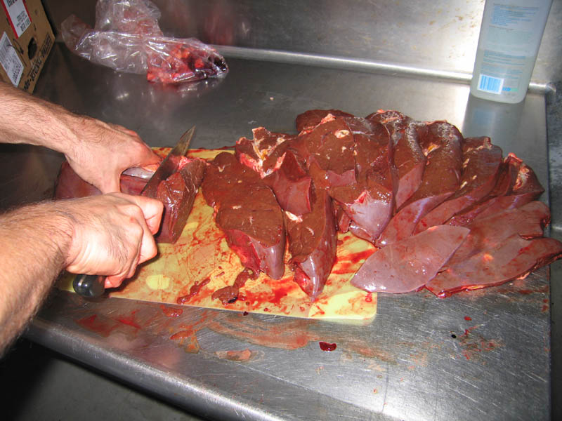 21. More butchering of a cow liver.