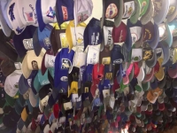 Toad River Lodge Ceiling Hat Collection, on Highway 97 Brittish Columbia
