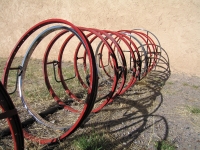 Bicycle rack made of recycled bike rims in T or C, NM