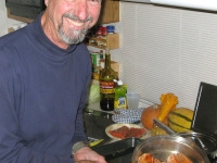 Sam cooks fresh wild Alaskan salmon he caught