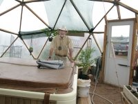 Sand Creek Realtor Duke in off Grid Greenhouse