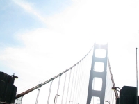 Sun shines through Golden Gate Bridge