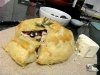 Homemade baked brie in pastry puff with almonds, cranberries and honey by Sonja