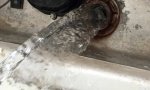 Drain RV water heater to replace check valve.