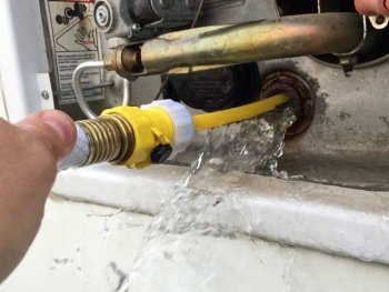 Rinse RV water heater with tank rinser hose adapter.