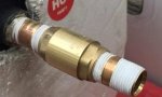 Assemble adapters to fit RV water heater check valve.