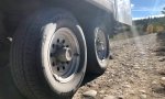 Trailer tires on rocky road at Spread Creek