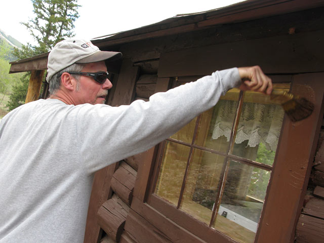 Jim painting cabins workamping at Vickers Guest Ranch