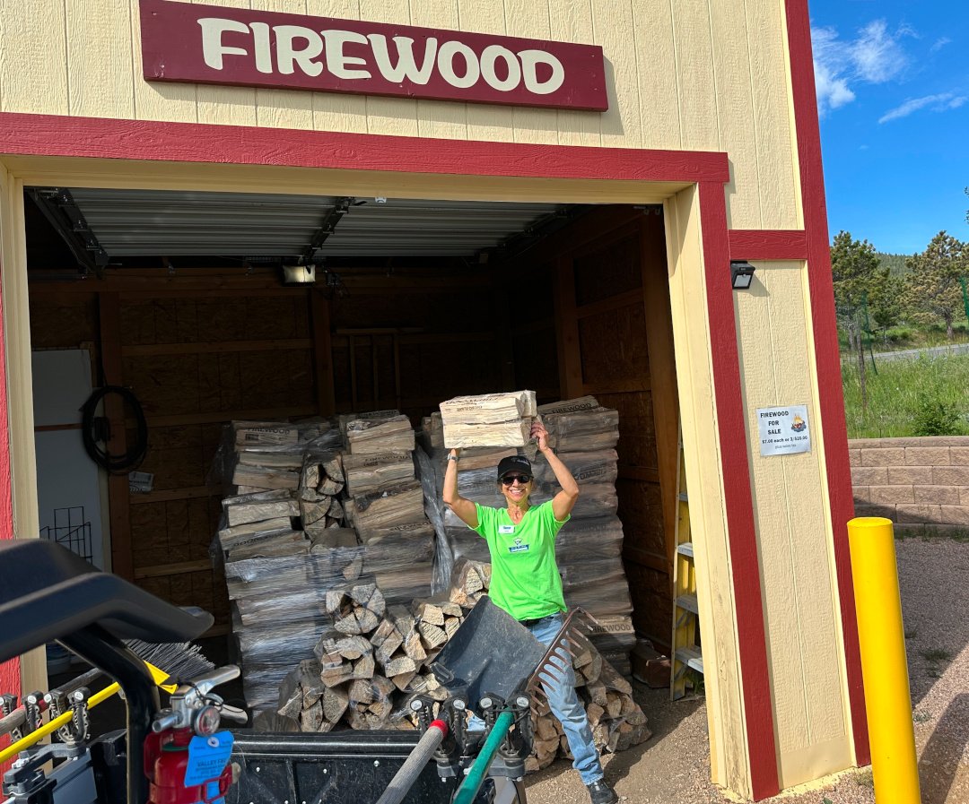 Rene camp hosting and stacking wood
