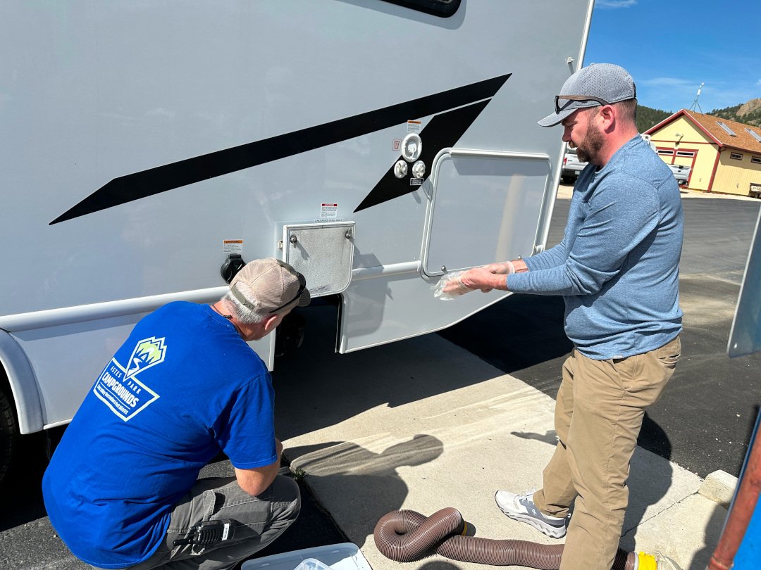 Jim shows RV newbie how to use dump station