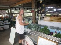 Restocking organic produce at the White Rabbit Acres farm store