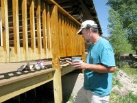 Jim painting the new deck behind Vickers Ranch rec hall