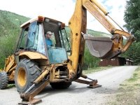 Jim plants signposts with backhoe