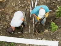Jim and Paul install stop waste valve at new wellhouse