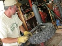 Jim repairs Jeep tire workamping at Vickers Ranch