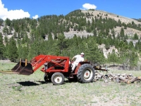 Jim splitting logs workamping at Vickers Guest Ranch