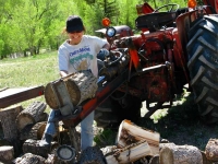 Rene splitting logs workamping at Vickers Guest Ranch