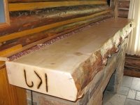Handmade log Fireplace mantle Made Workamping at Ranch