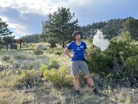 Camp host Rene picking up trash