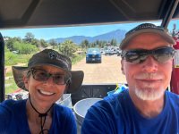 Rene and Jim escort camper to tent site