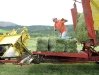 Jim ties bales on the stacker while haying at Vickers Ranch