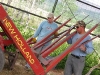 Jim and Paul ponder broken stacker at Vickers Ranch Hay Barn