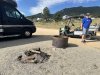 Camp host Jim cleaning up messy campfire