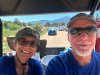 Rene and Jim escort camper to tent site