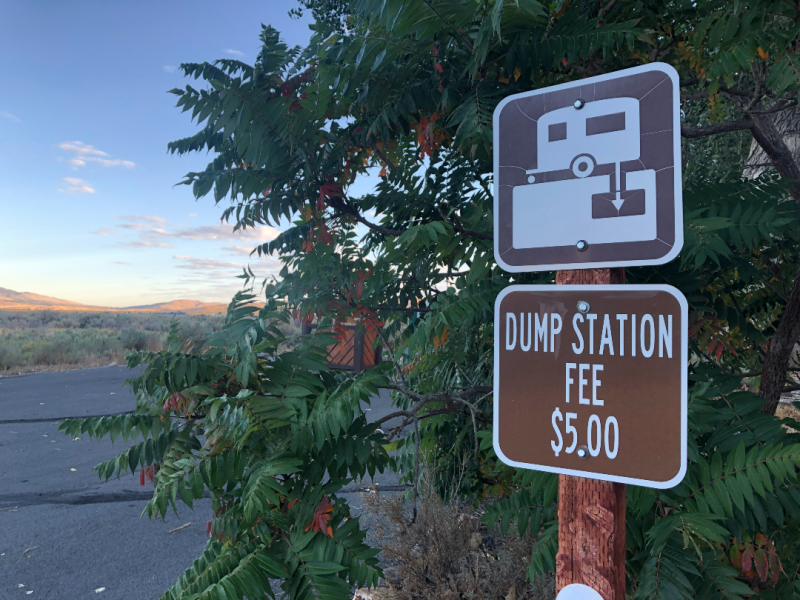 public dump station with fee sign