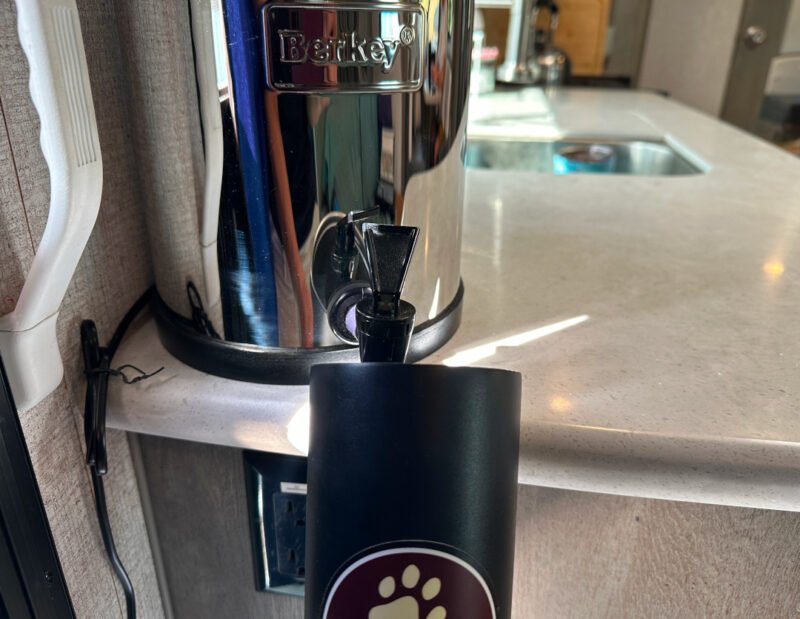 Pouring water from Berkey Travel Water Filter