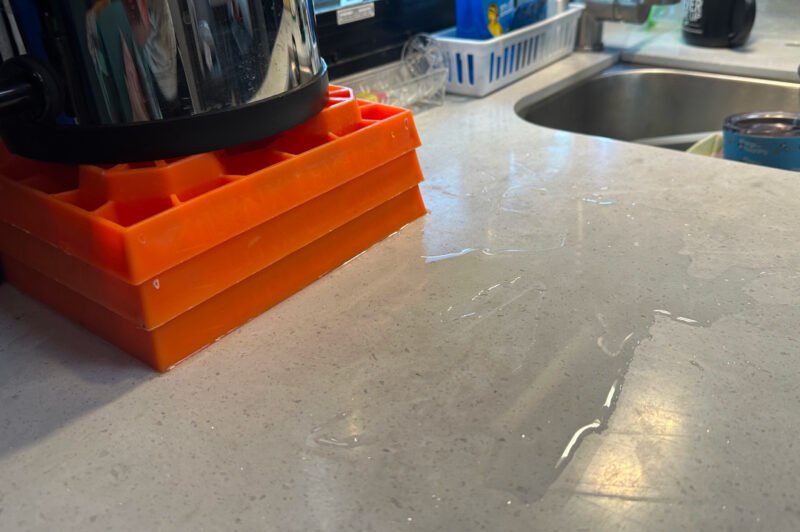 Overfilled Berkey Travel Water Filter on RV countertop